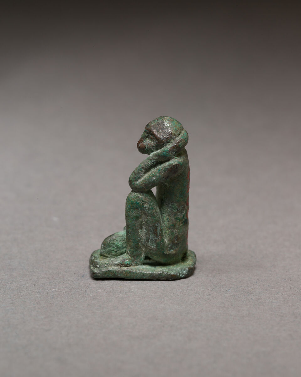 Monkey kneeling and resting its head in a hand, Bronze