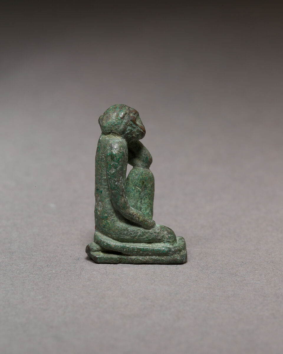 Monkey kneeling and resting its head in a hand, Bronze