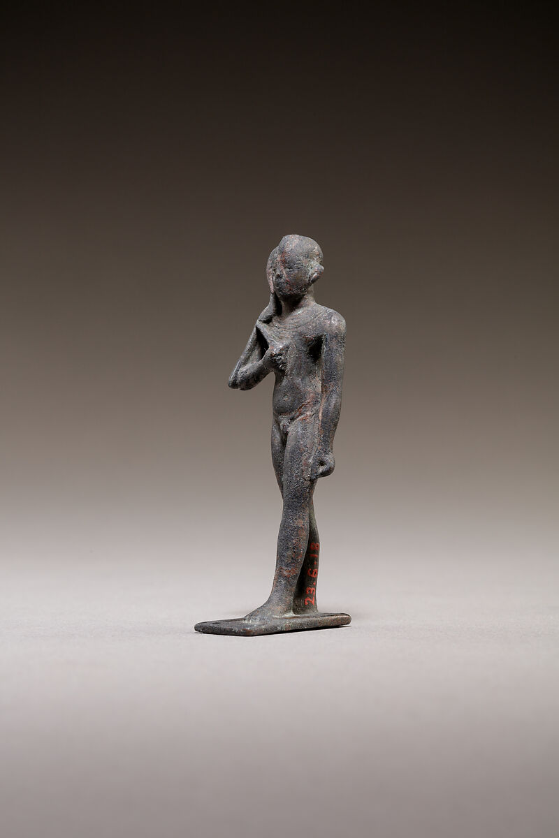 Child god standing and holding a flail, Bronze or cupreous alloy
