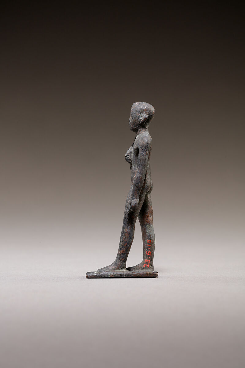 Child god standing and holding a flail, Bronze or cupreous alloy