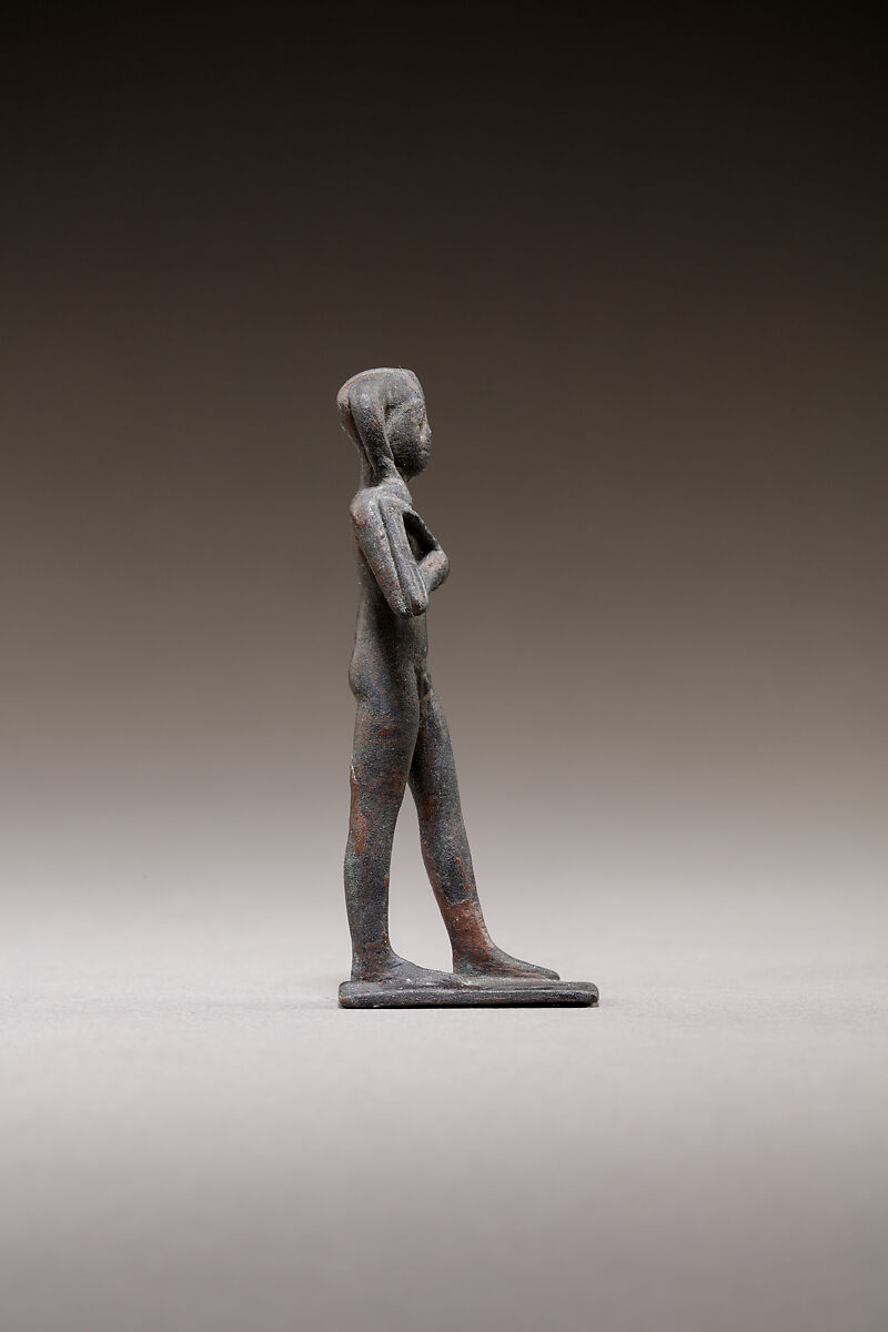 Child god standing and holding a flail, Bronze or cupreous alloy