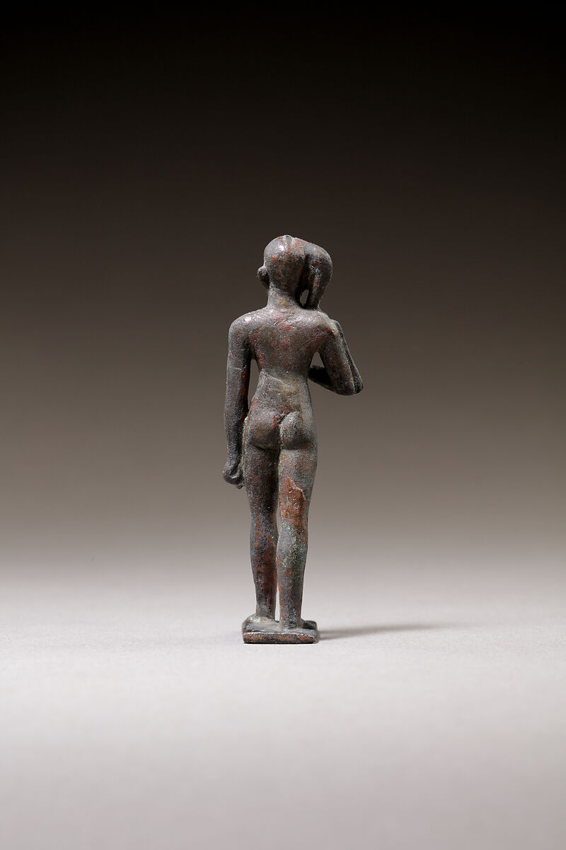 Child god standing and holding a flail, Bronze or cupreous alloy