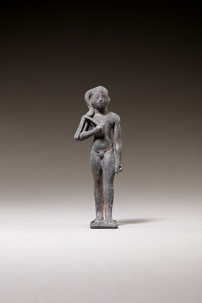 Child god standing and holding a flail, Bronze or cupreous alloy 