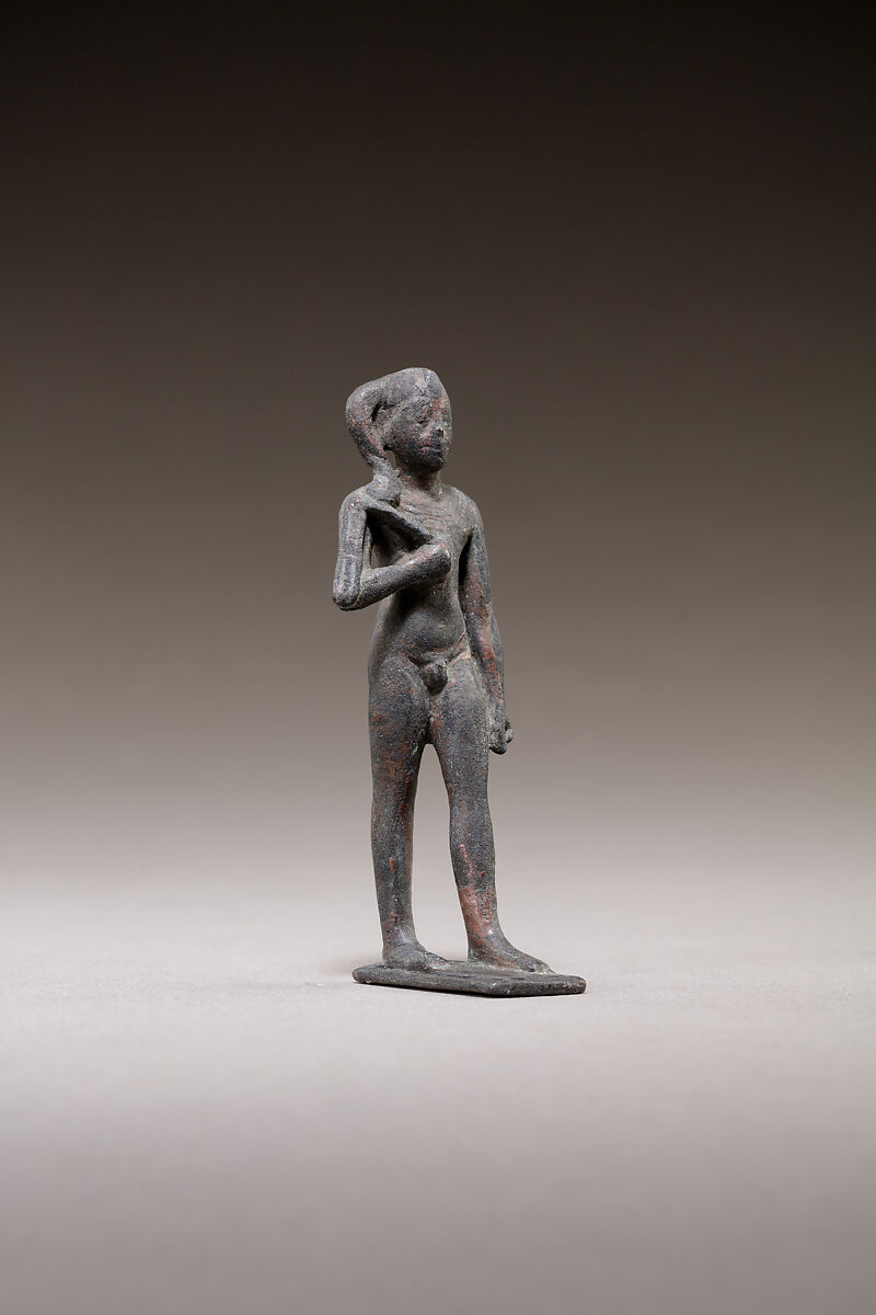 Child god standing and holding a flail, Bronze or cupreous alloy