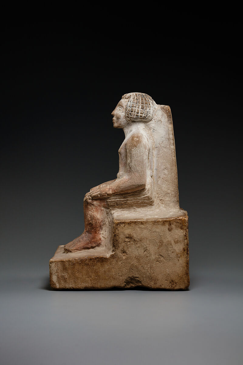 Seated man, Limestone