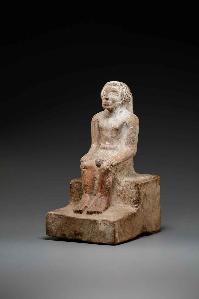 Seated man, Limestone