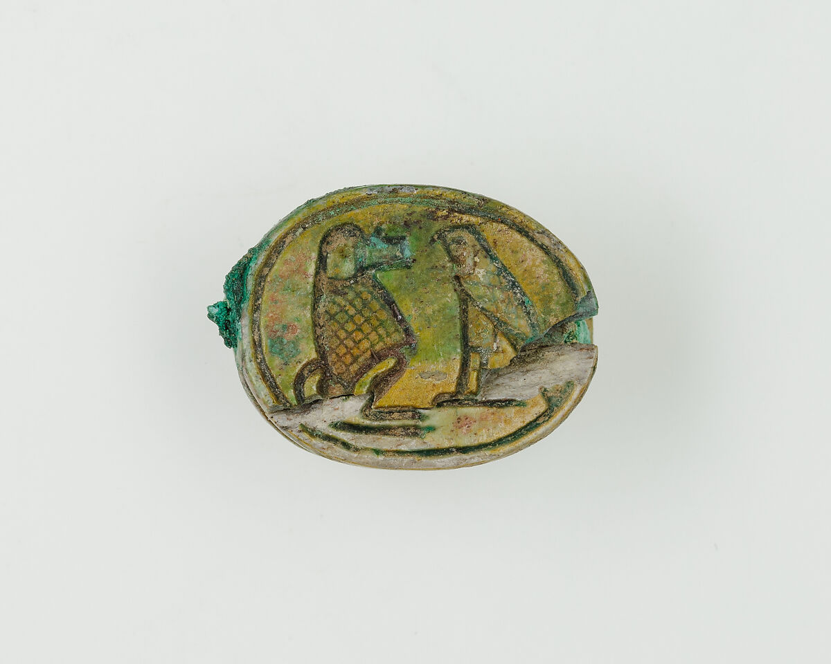 Scarab with device of baboon and falcon on base, Green glazed steatite 