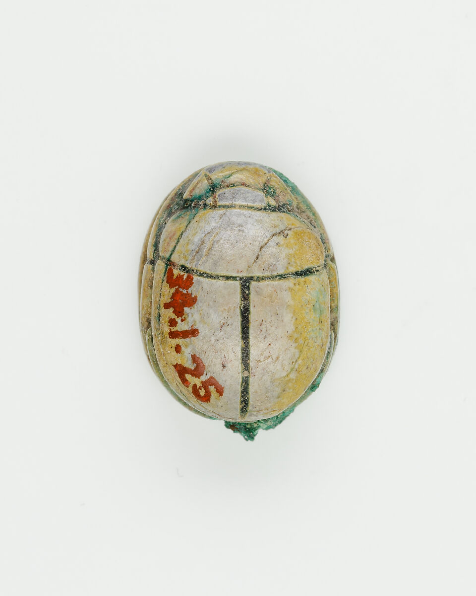 Scarab with device of baboon and falcon on base, Green glazed steatite