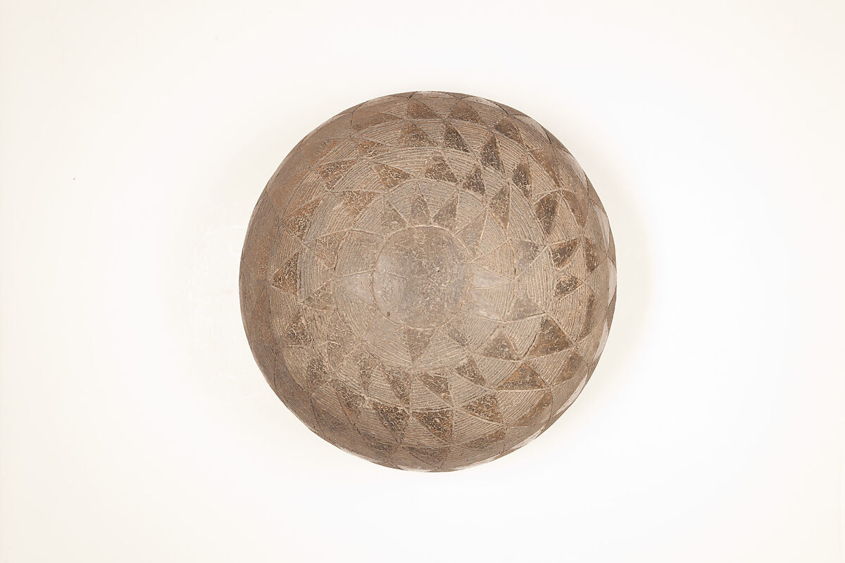 Drinking Cup, Polished black ware with traces of white filling.