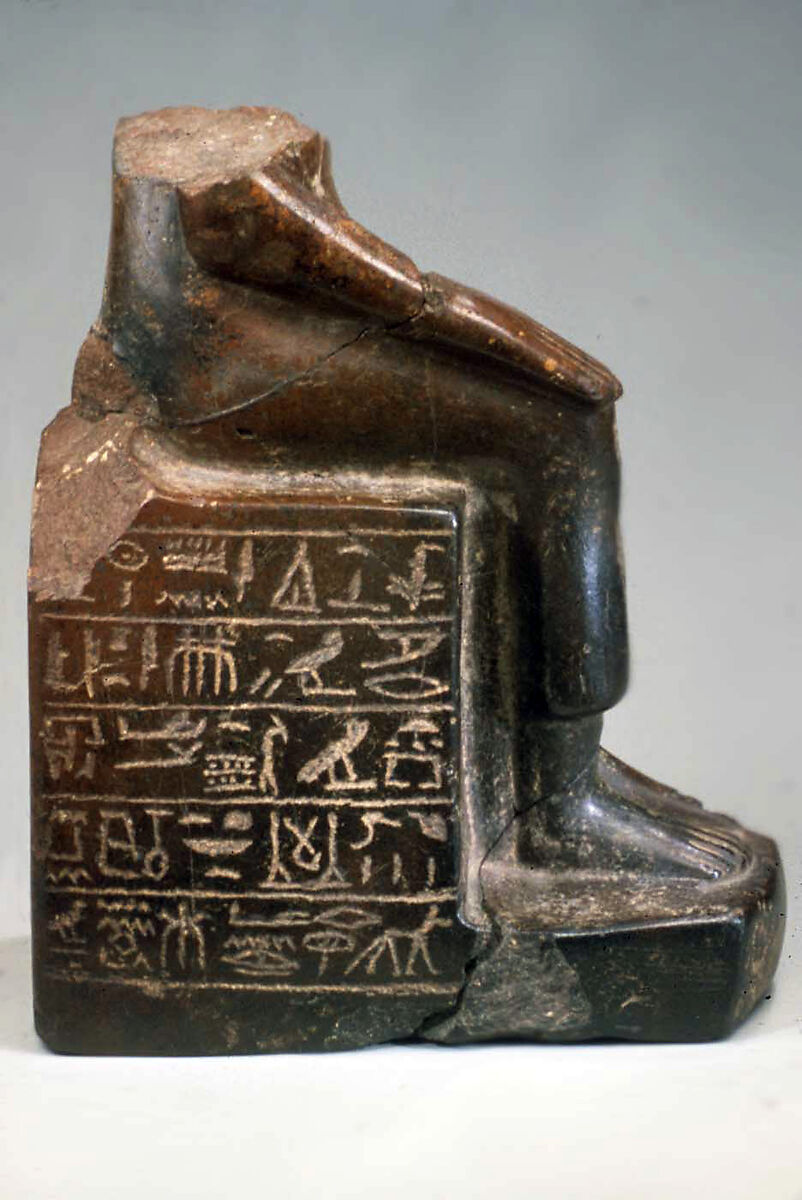 Lower half of the figure of the dignitary Anu, Stone