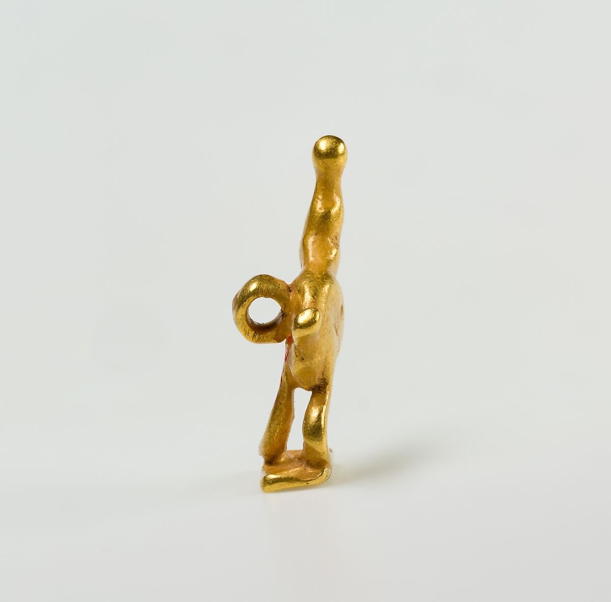 Quail chick amulet, Gold