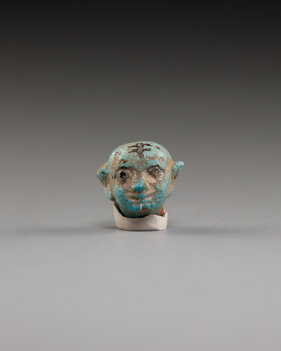 Head from female figurine, Green faience 