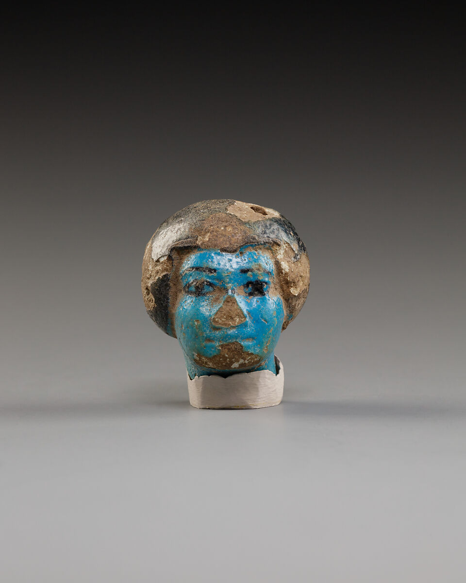 Figurine of head, Blue faience, pigment 