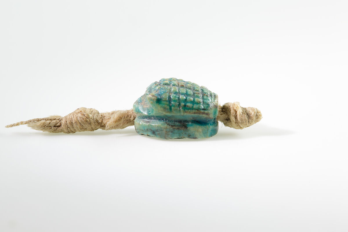 Seal in the shape of a hedgehog on original string, Green glazed steatite