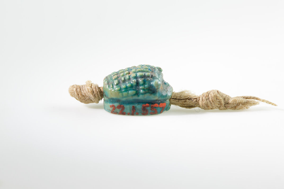 Seal in the shape of a hedgehog on original string, Green glazed steatite