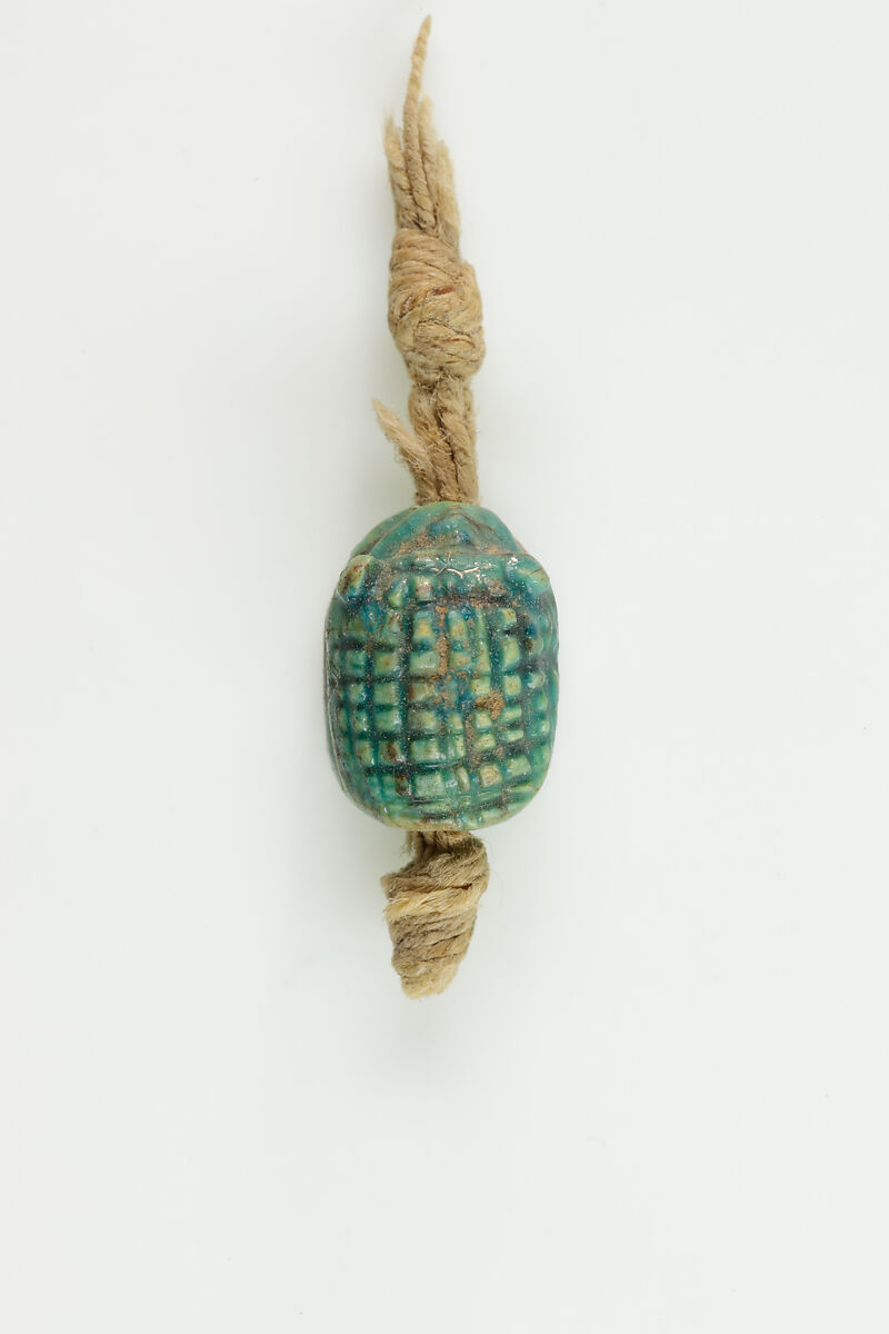 Seal in the shape of a hedgehog on original string, Green glazed steatite