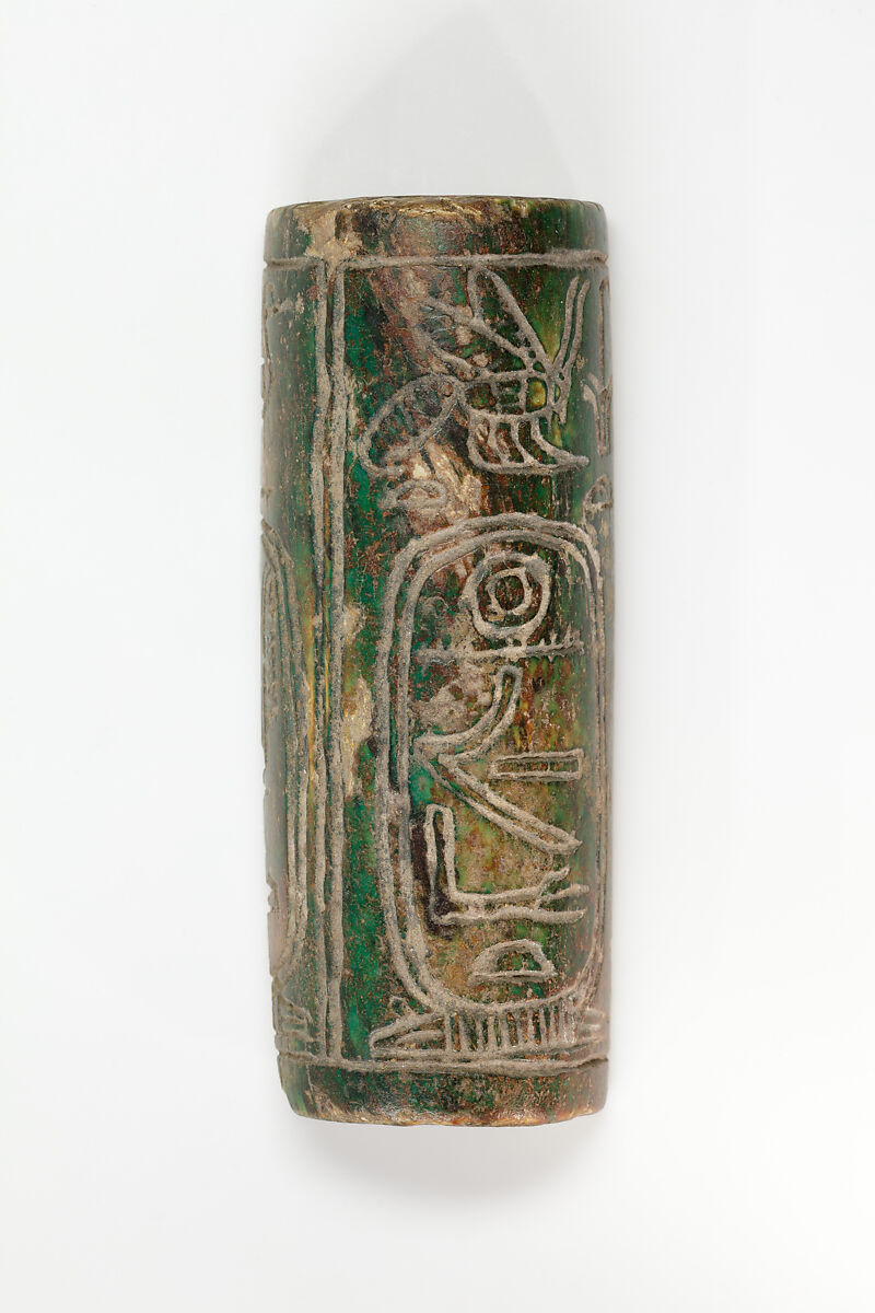 Half of a cylinder seal with names of Amenemhat III, Dark green glazed steatite 