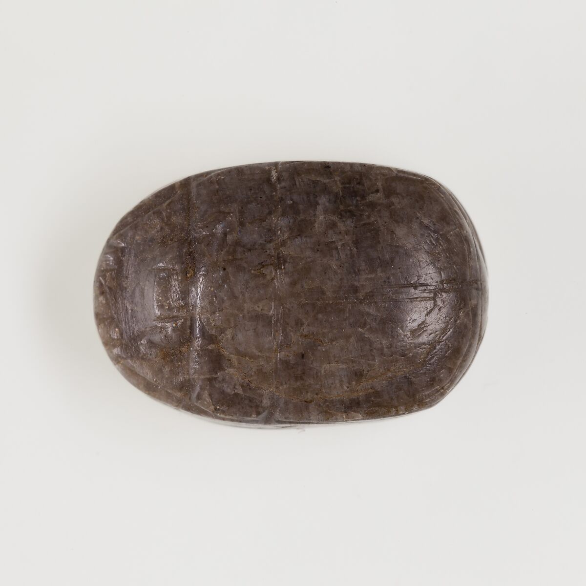 Scarab, uninscribed, Greyish-brown stone 