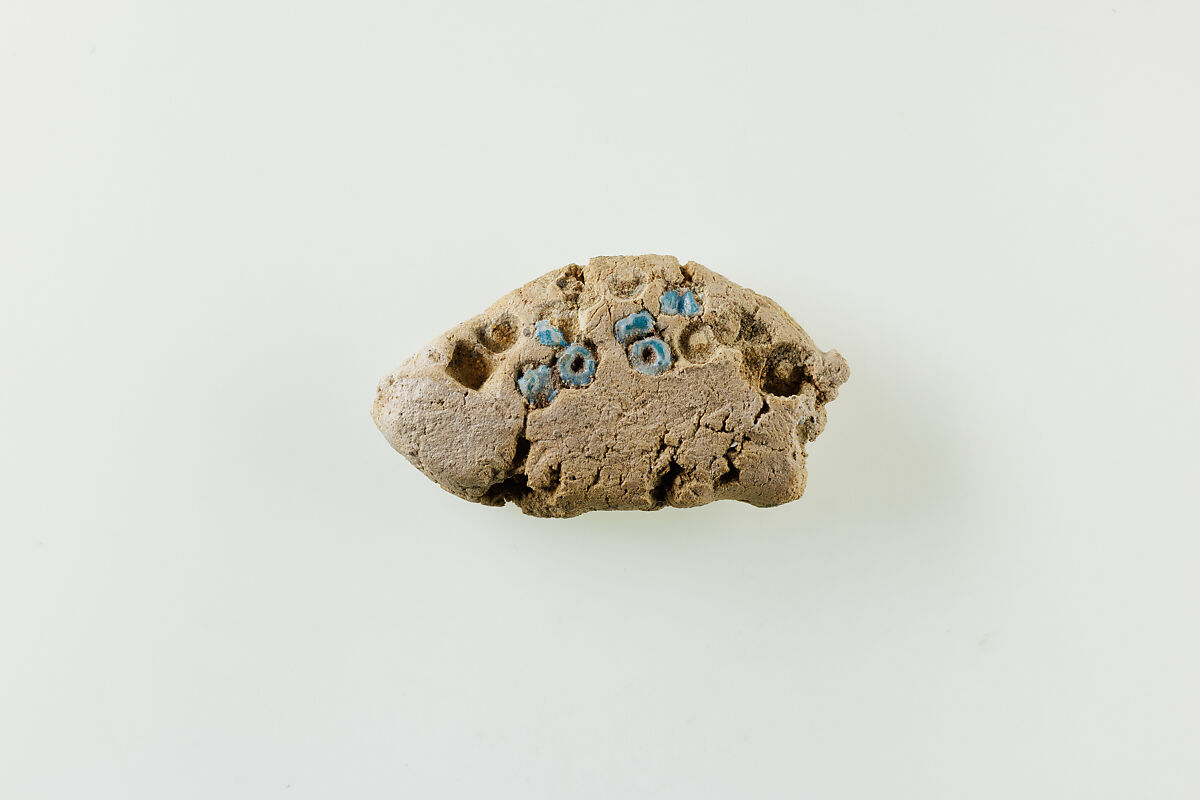 Fragment of clay lump with imbedded ring beads, Clay, faience 