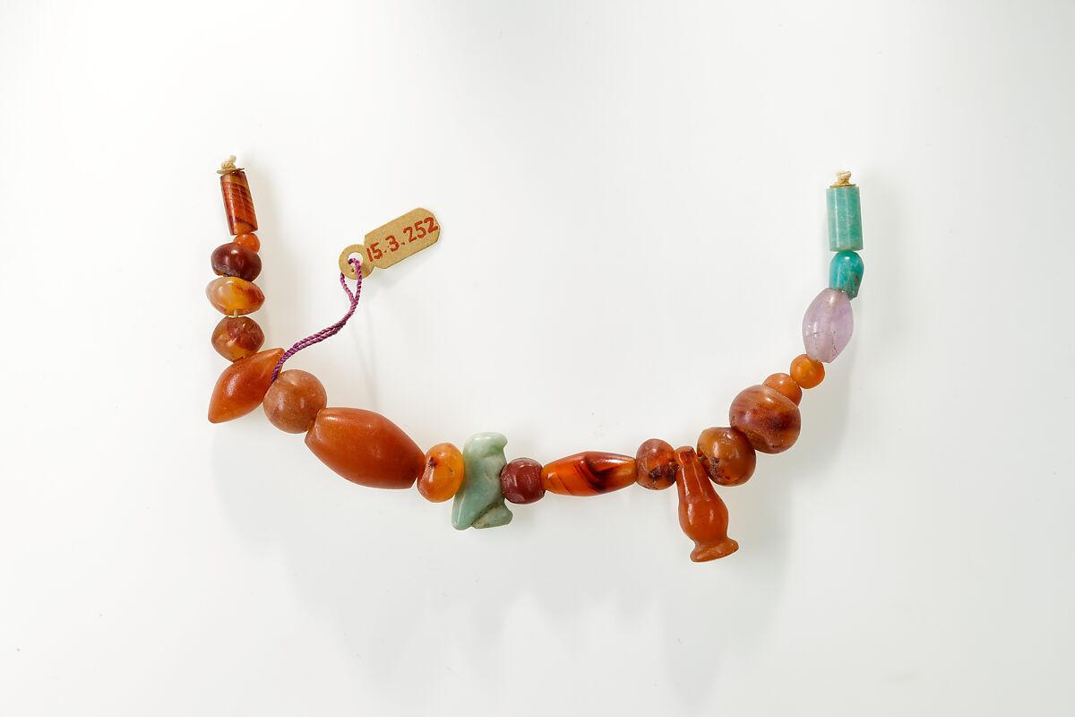 String of beads, hawk amulet and cornflower pendant, Green feldspar, amethyst, carnelian 