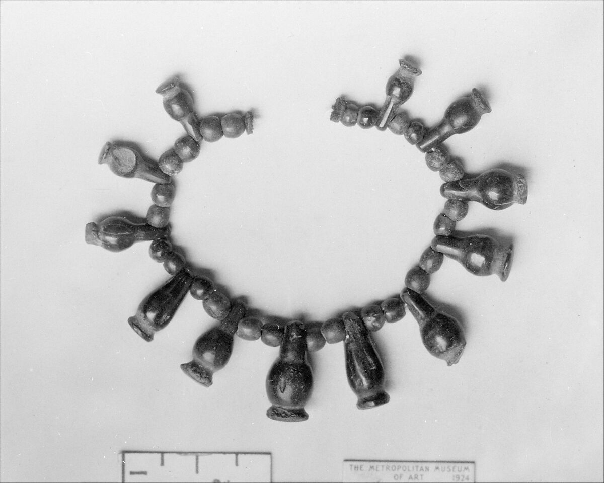 String of Carnelian Beads and Poppy Pendants, Carnelian