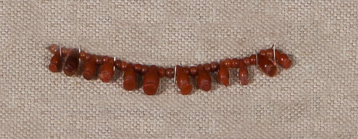 String of Carnelian Beads and Poppy Pendants, Carnelian 