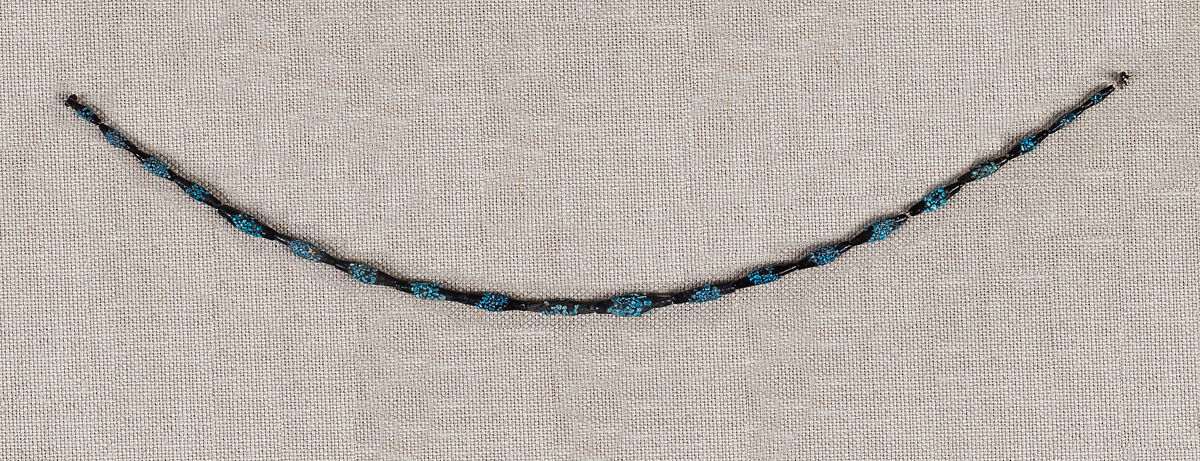 String of black faience beads with encrustations, Blue and black faience 