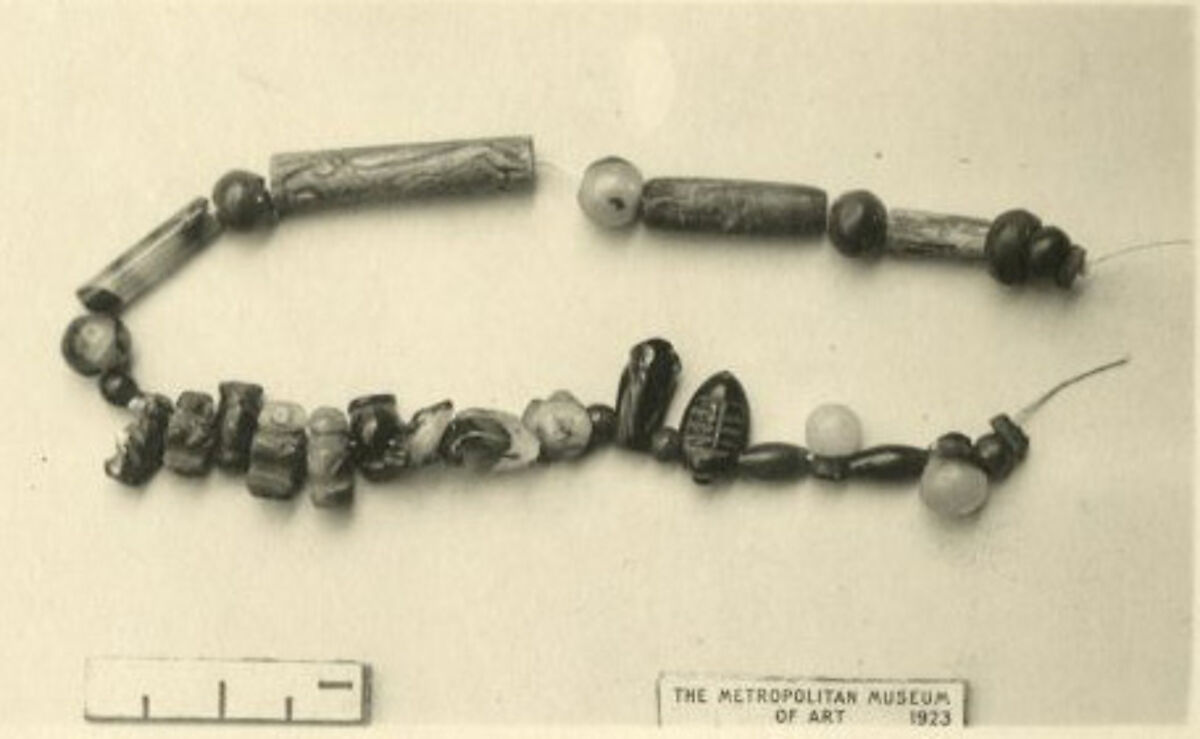 String of beads and amulets, Faience, carnelian, lapis lazuli, amethyst, stone, shell, pottery