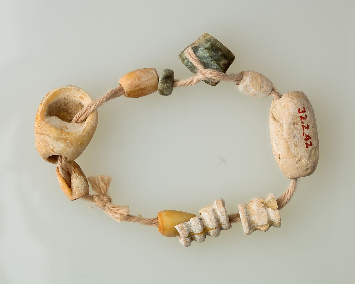 String of beads, Bone, serpentinite, shell 
