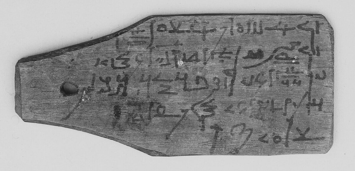 Mummy label of Petempto the younger, age 79, son of Petemin; his mother Kolluthe, Wood, ink