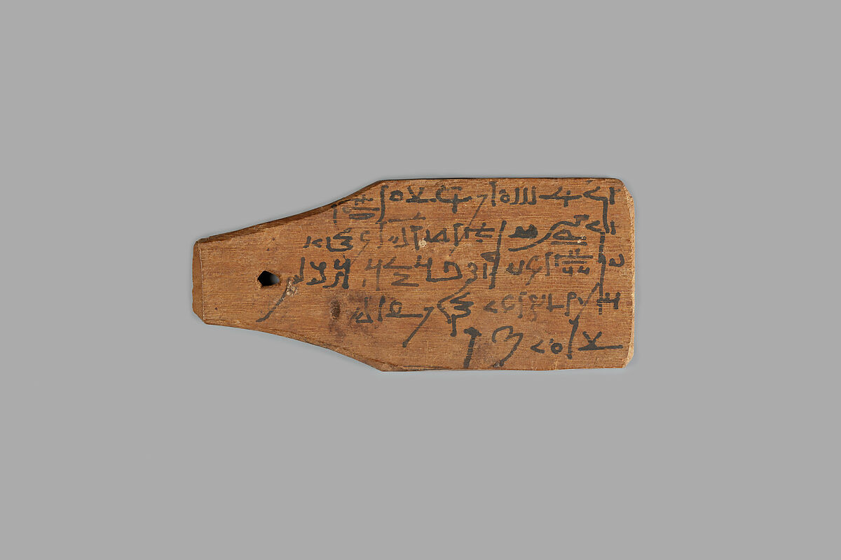 Mummy label of Petempto the younger, age 79, son of Petemin; his mother Kolluthe, Wood, ink 