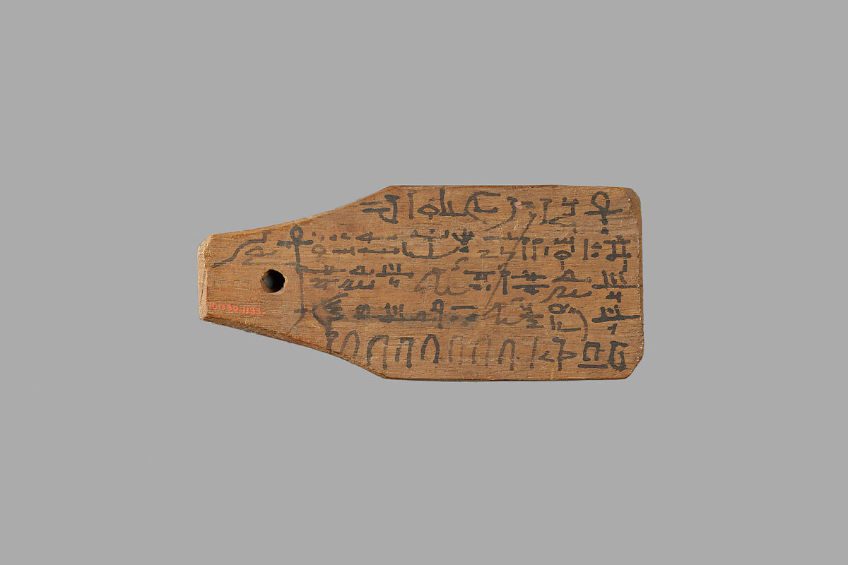 Mummy label of Petempto the younger, age 79, son of Petemin; his mother Kolluthe, Wood, ink