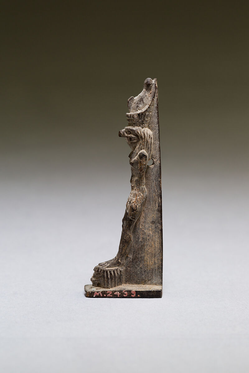 Horus standing on two captives' heads, wood