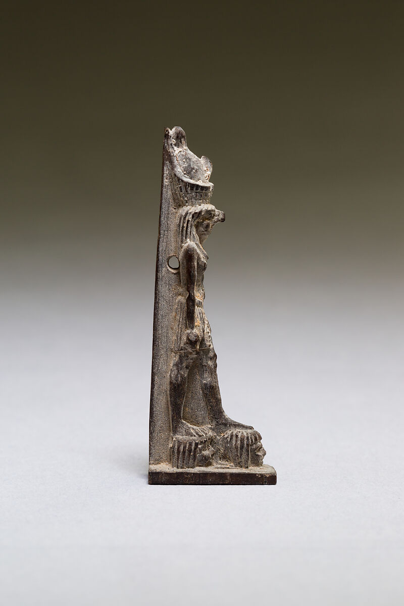 Horus standing on two captives' heads, wood