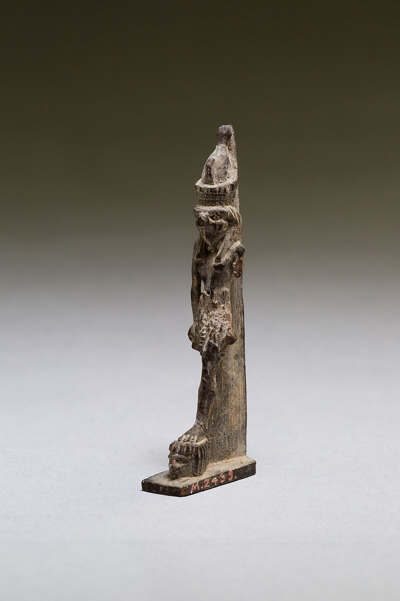 Horus standing on two captives' heads, wood