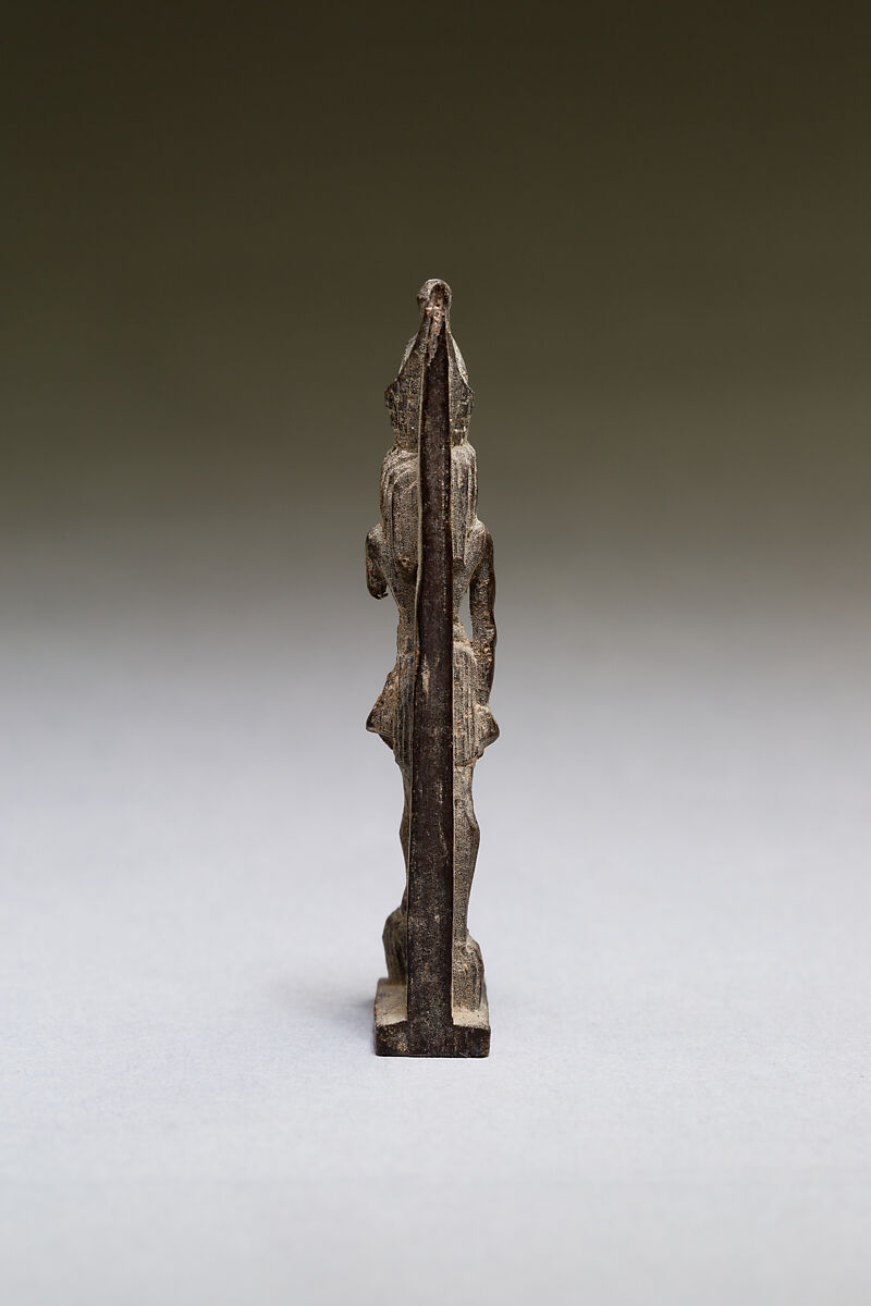 Horus standing on two captives' heads, wood