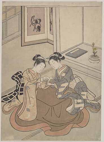 Two Young Women Seated by a Kotatsu Playing Cat's Cradle