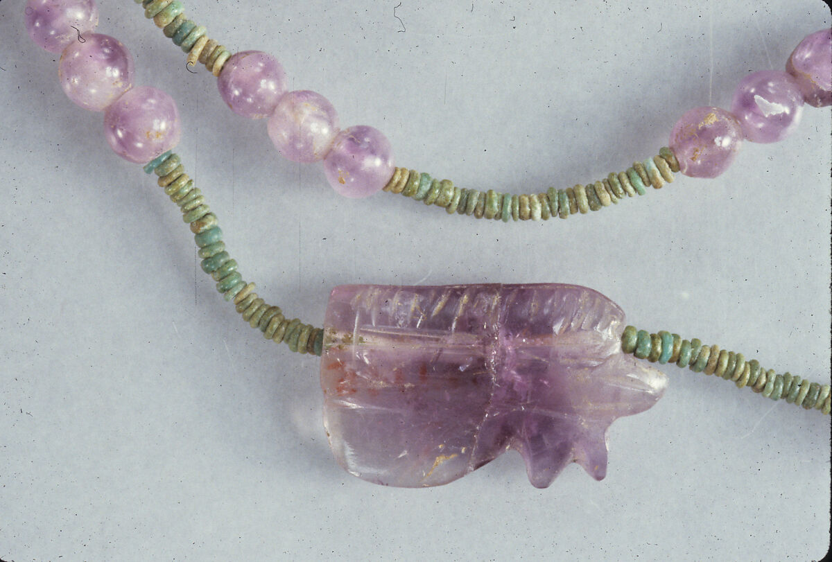 String of 63 ball beads and 1 wedjat amulet of Hepy, Amethyst, green faience