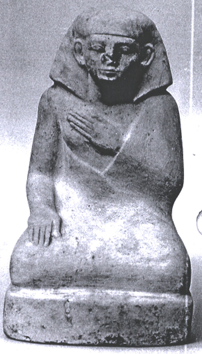Statuette of a squatting man, Indurated limestone 