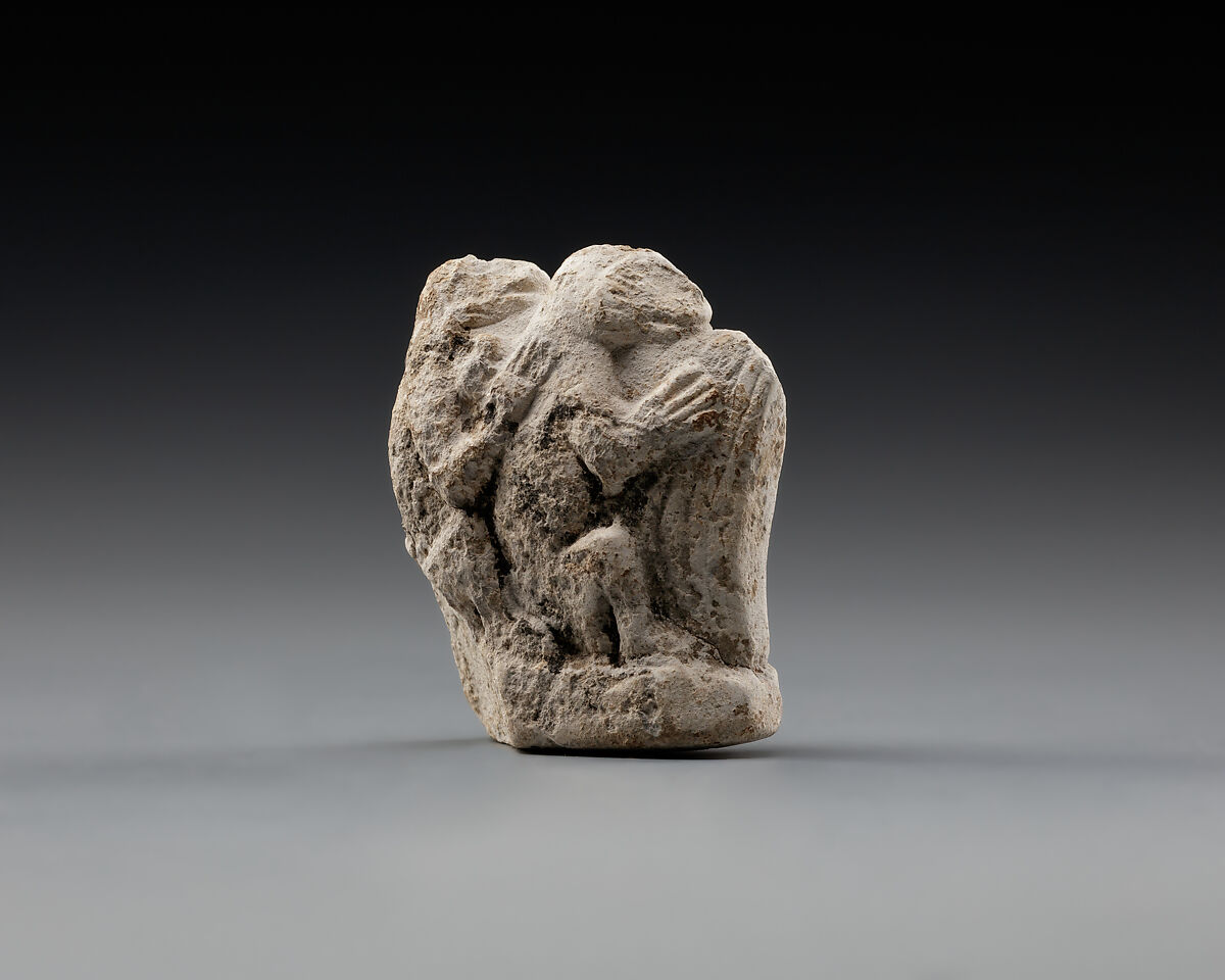 Monkey couple, the first playing a harp?, Limestone