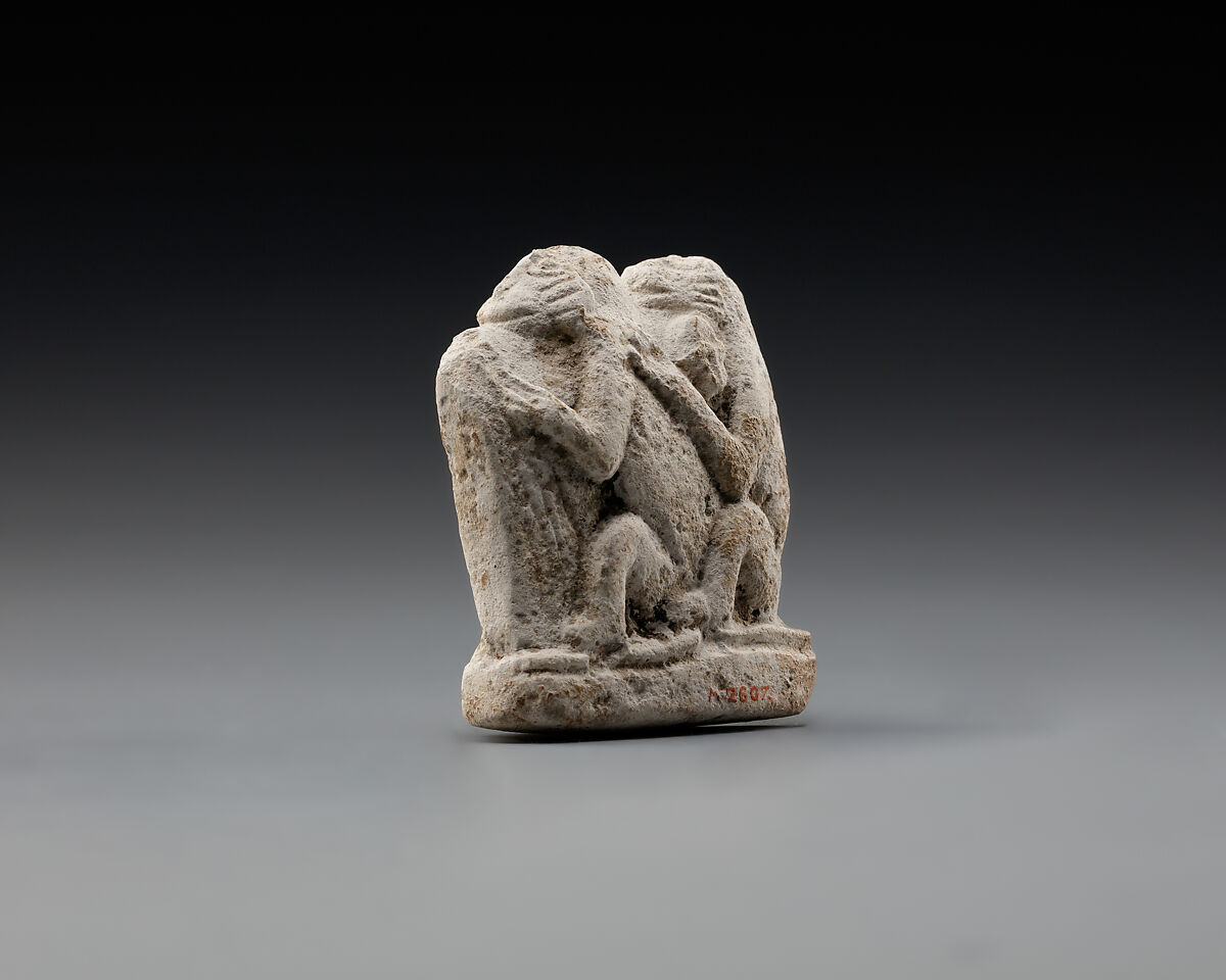 Monkey couple, the first playing a harp?, Limestone