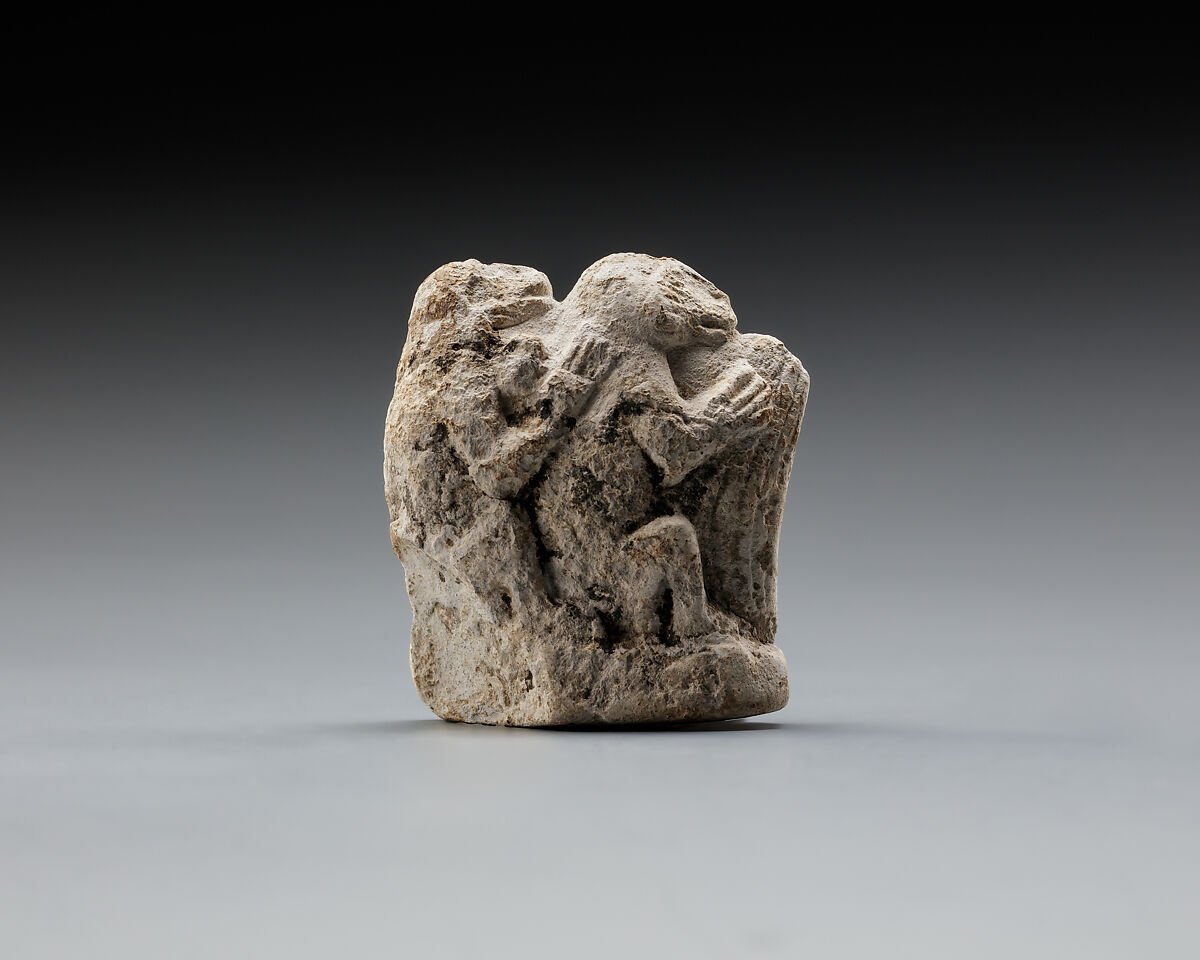 Monkey couple, the first playing a harp?, Limestone