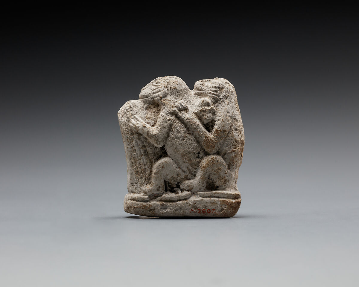 Monkey couple, the first playing a harp?, Limestone 