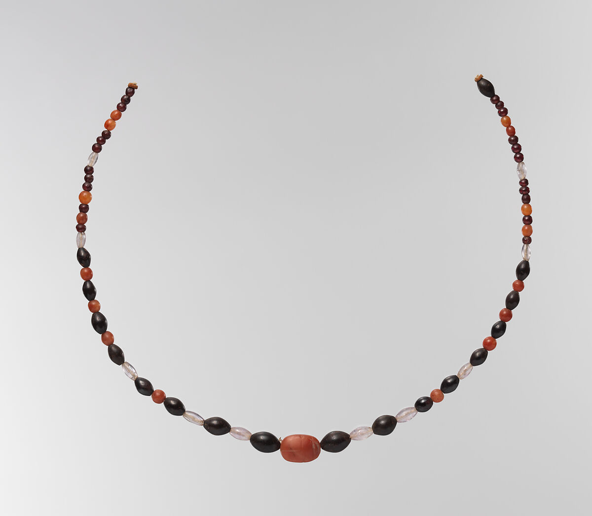 String of beads with scarab, Carnelian, amethyst, garnet, hematite; modern string 