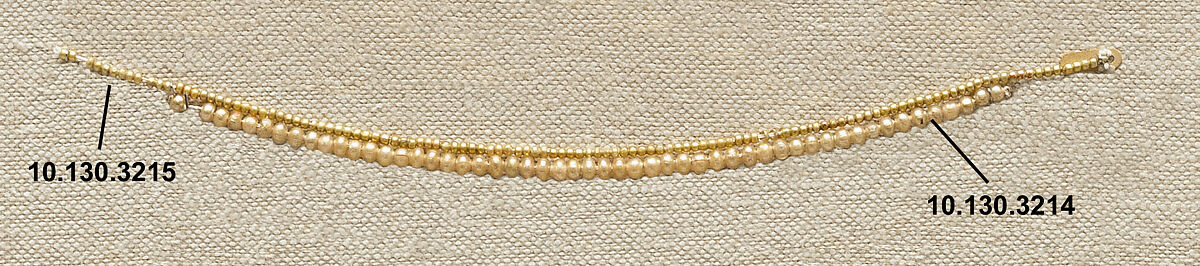 String of 53 Beads, Gilt glass