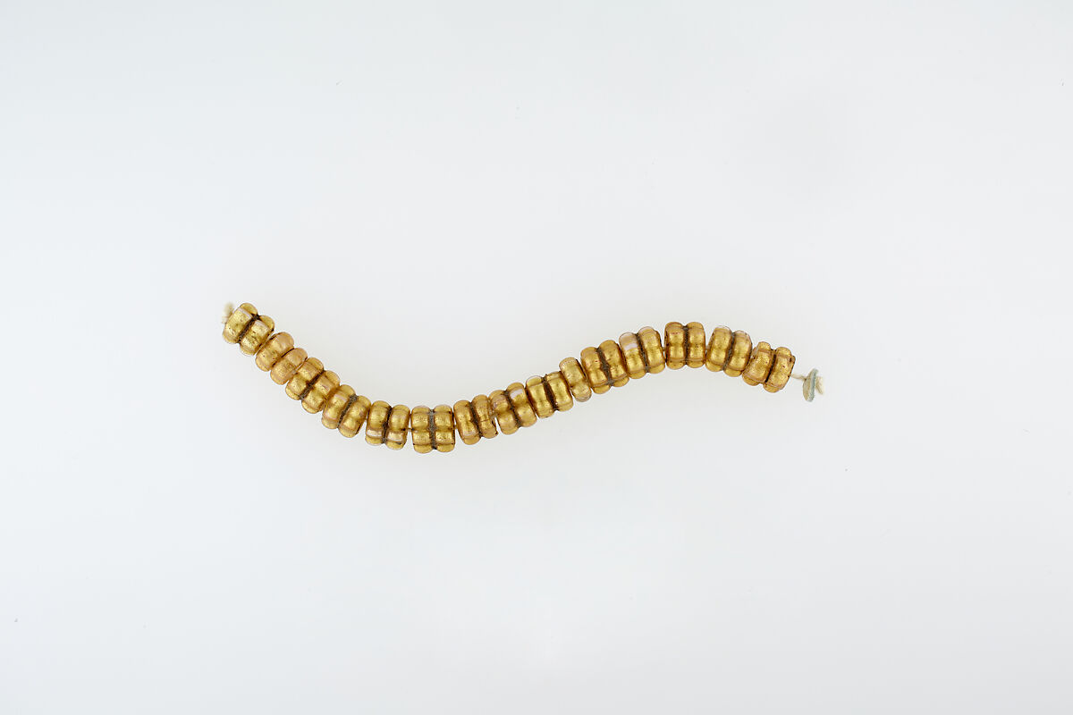 String of 29 Beads, glass, gold foil 