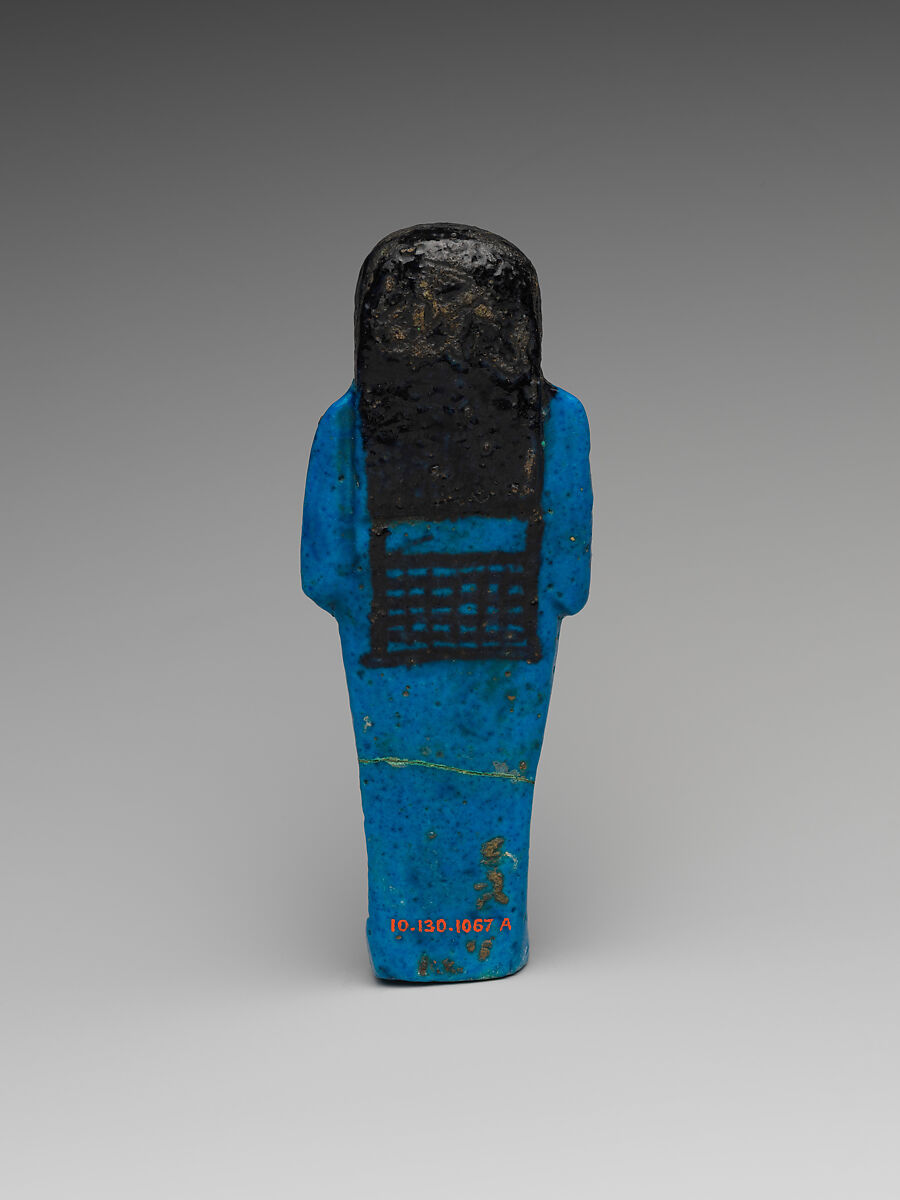 Shabti of the Adoratrice of Hathor Henettawy, wife of Painedjem I, Faience