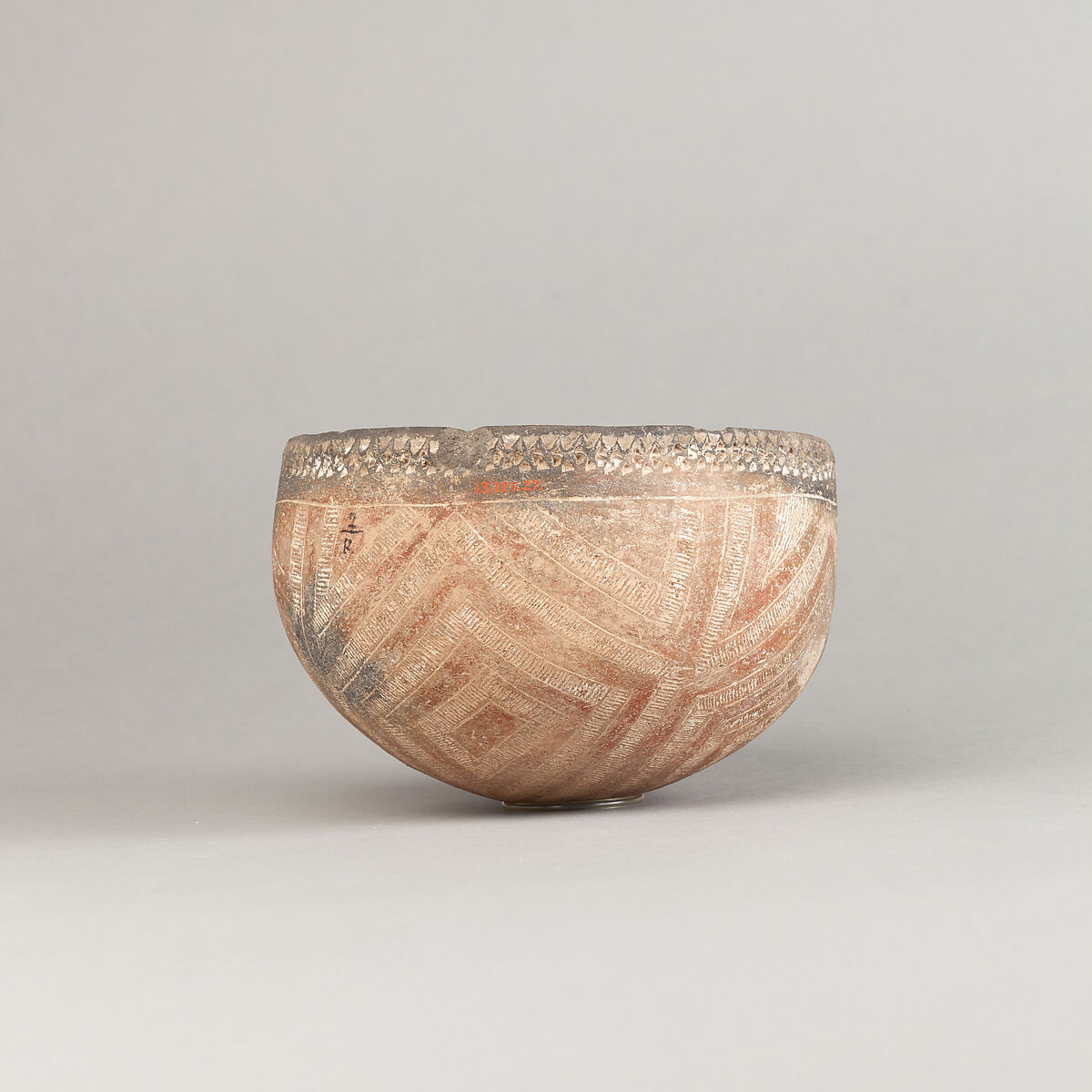 Drinking Cup, Polished black ware with decoration filled with white pigment