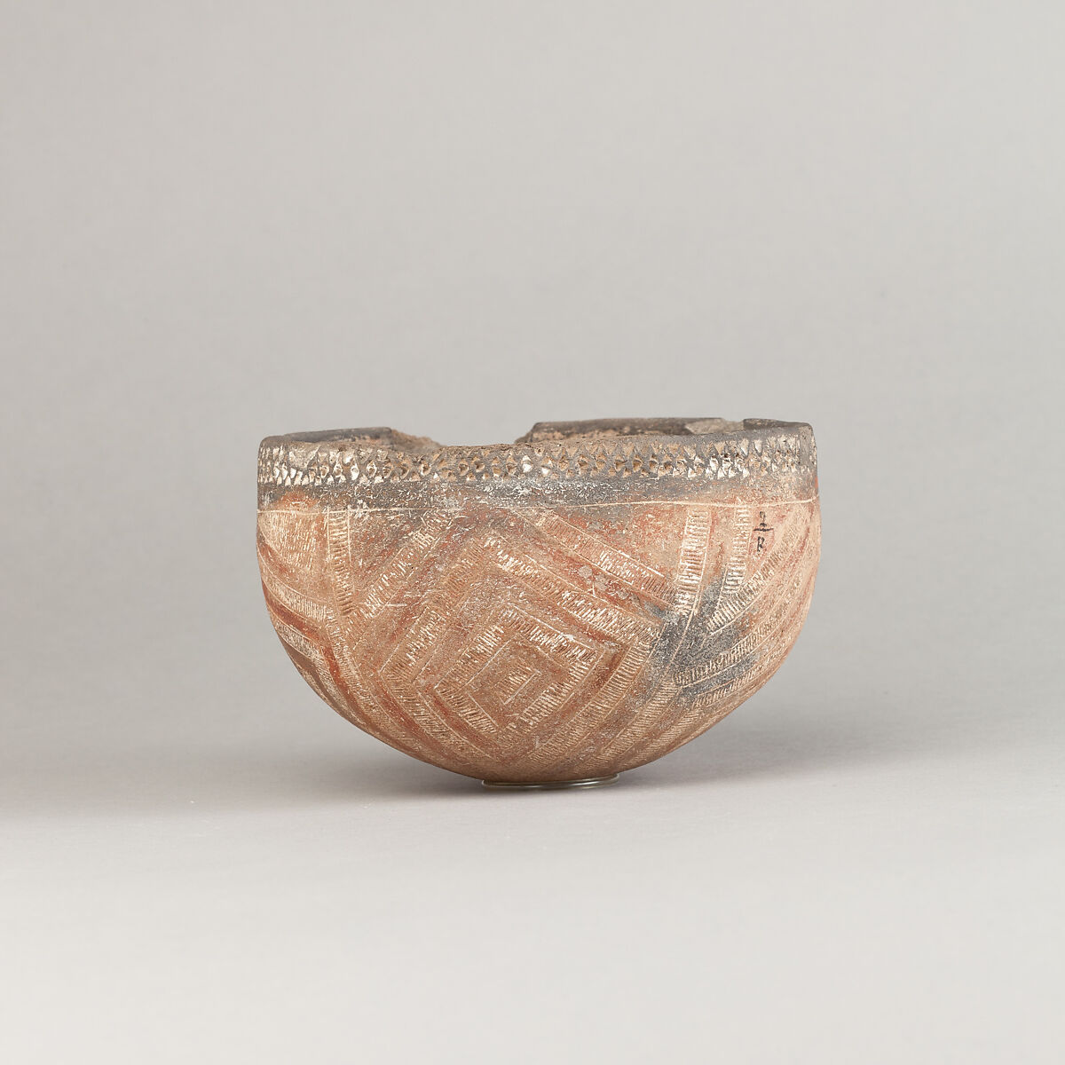 Drinking Cup, Polished black ware with decoration filled with white pigment