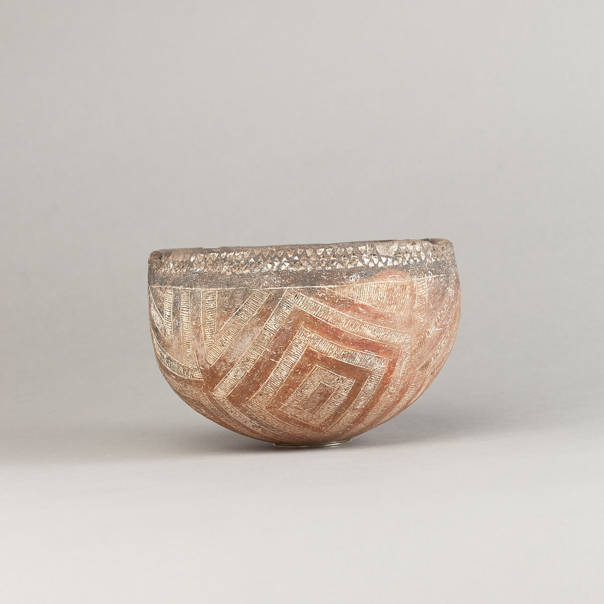 Drinking Cup, Polished black ware with decoration filled with white pigment 